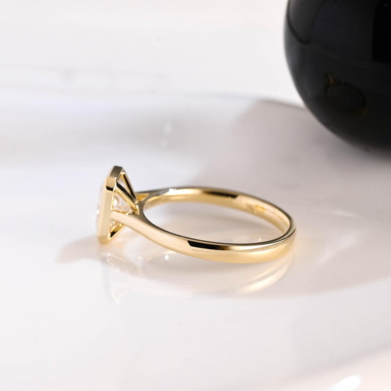 Raised engagement ring profile with hidden detail and pavé shoulders
