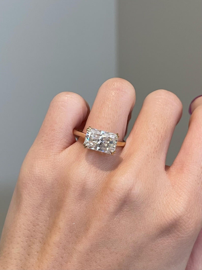 Elongated marquise diamond shape suitable for east-west setting