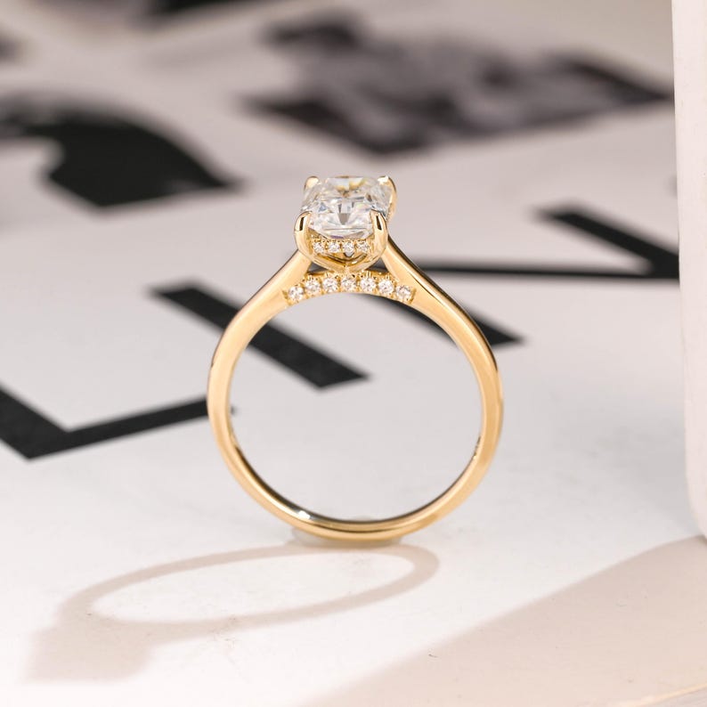 Cathedral engagement ring side profile showing raised shoulders