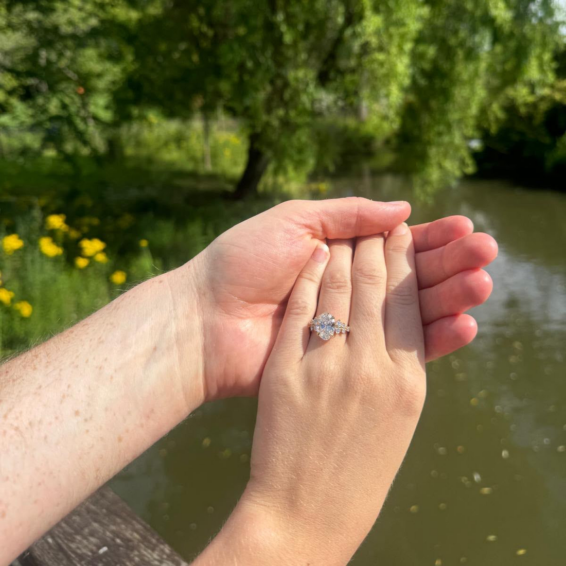 Heloise wearing her bespoke 4 carat oval diamond engagement ring