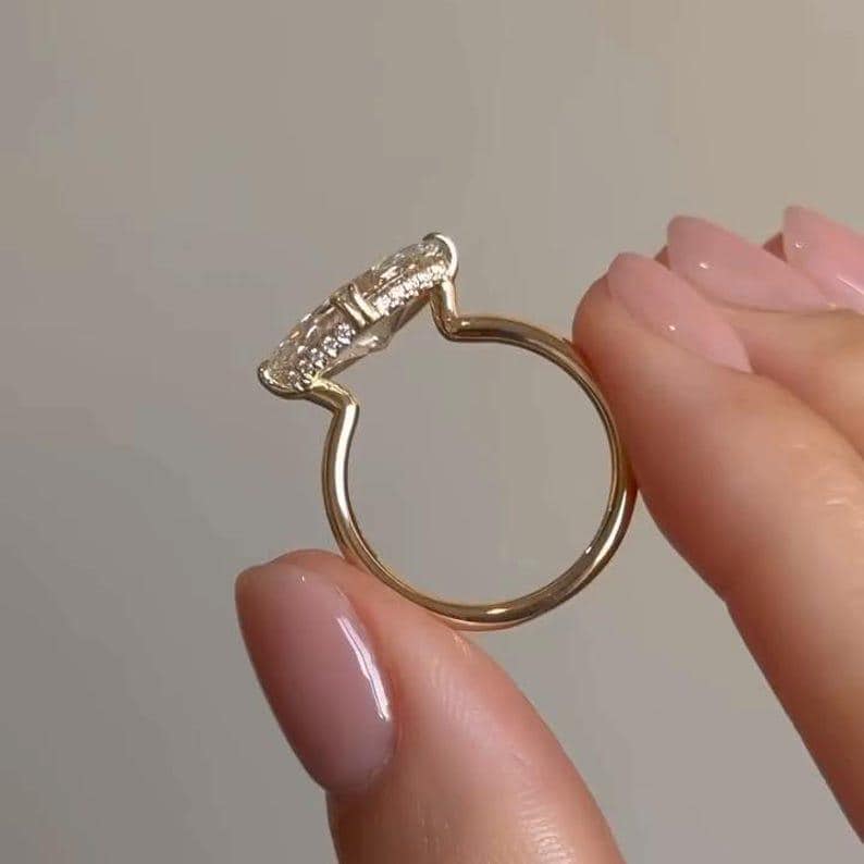 Bespoke engagement ring with hidden halo and pavé shank