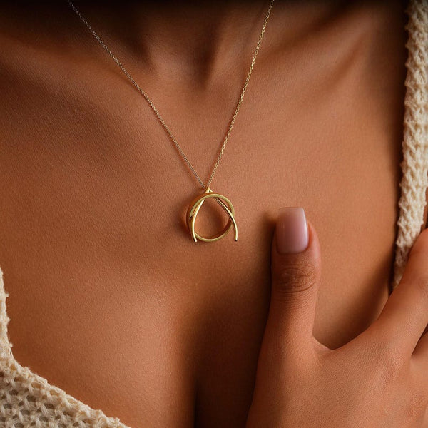 Ring keeper necklace holding an engagement ring