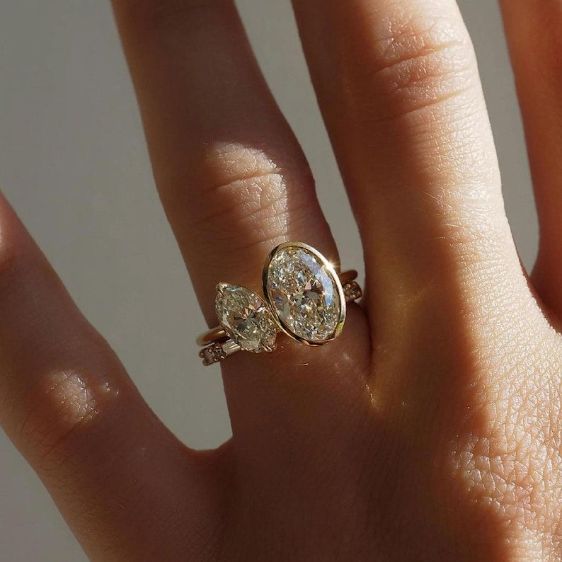 Toi et moi engagement ring with two stones set side by side