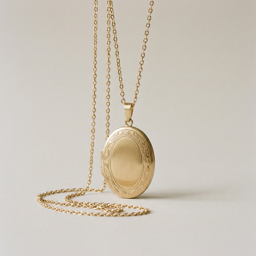 Three-stone engagement ring — oval centre with trapeze shoulders, platinum