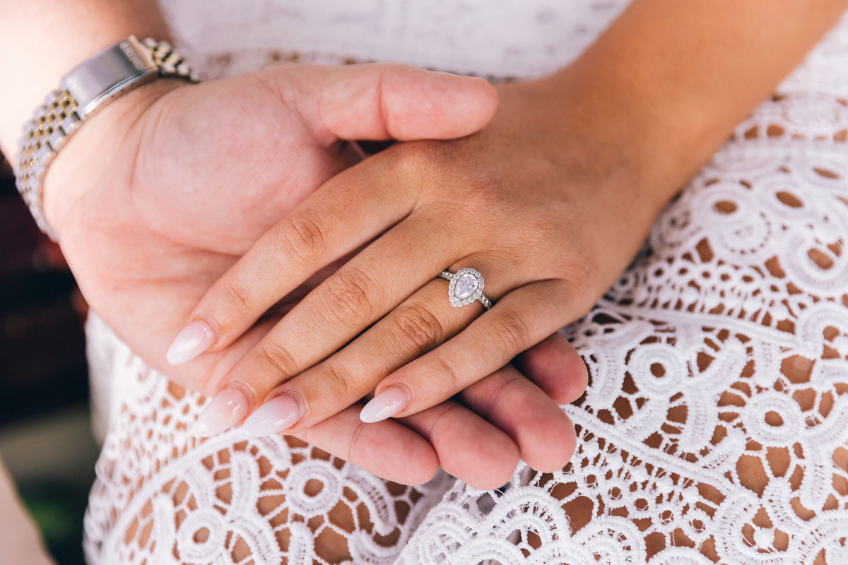 Pavé engagement ring with diamond-set shoulders